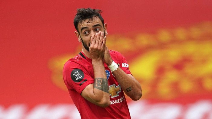 MANCHESTER, ENGLAND - JULY 04: Bruno Fernandes of Manchester United reacts after a missed chance during the Premier League match between Manchester United and AFC Bournemouth  at Old Trafford on July 04, 2020 in Manchester, England. Football Stadiums around Europe remain empty due to the Coronavirus Pandemic as Government social distancing laws prohibit fans inside venues resulting in all fixtures being played behind closed doors. (Photo by Dave Thompson/Pool via Getty Images)