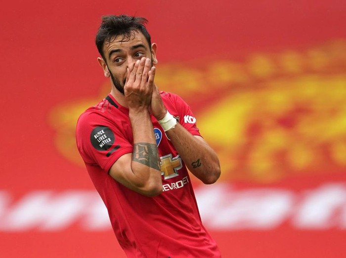 MANCHESTER, ENGLAND - JULY 04: Bruno Fernandes of Manchester United reacts after a missed chance during the Premier League match between Manchester United and AFC Bournemouth  at Old Trafford on July 04, 2020 in Manchester, England. Football Stadiums around Europe remain empty due to the Coronavirus Pandemic as Government social distancing laws prohibit fans inside venues resulting in all fixtures being played behind closed doors. (Photo by Dave Thompson/Pool via Getty Images)