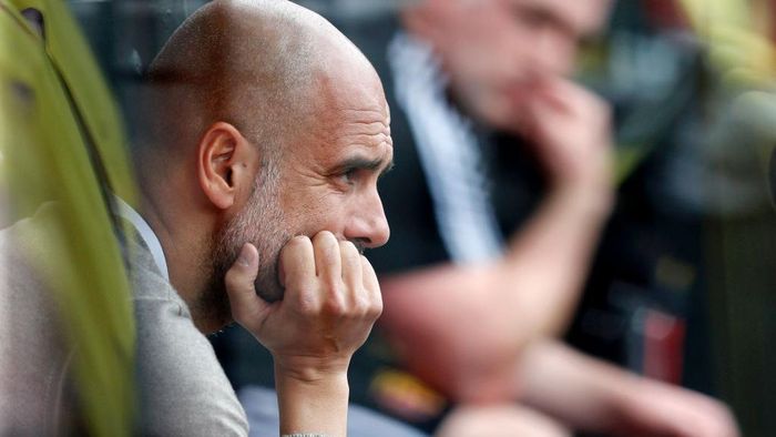 Pep Guardiola WATFORD, ENGLAND - JULY 21: Pep Guardiola, Manager of Manchester City looks on from the bench prior to the Premier League match between Watford FC and Manchester City at Vicarage Road on July 21, 2020 in Watford, England. Football Stadiums around Europe remain empty due to the Coronavirus Pandemic as Government social distancing laws prohibit fans inside venues resulting in all fixtures being played behind closed doors. (Photo by Adrian Dennis/Pool via Getty Images)
