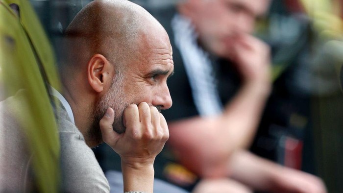 WATFORD, ENGLAND - JULY 21: Pep Guardiola, Manager of Manchester City looks on from the bench prior to the Premier League match between Watford FC and Manchester City at Vicarage Road on July 21, 2020 in Watford, England. Football Stadiums around Europe remain empty due to the Coronavirus Pandemic as Government social distancing laws prohibit fans inside venues resulting in all fixtures being played behind closed doors. (Photo by Adrian Dennis/Pool via Getty Images)