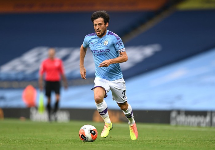 MANCHESTER, ENGLAND - JUNE 22:  David Silva of Manchester City runs with the ball during the Premier League match between Manchester City and Burnley FC at Etihad Stadium on June 22, 2020 in Manchester, England. (Photo by Shaun Botterill/Getty Images)