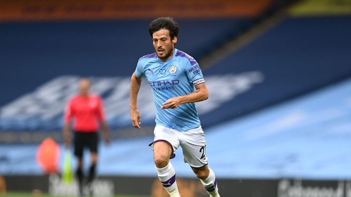 MANCHESTER, ENGLAND - JUNE 22:  David Silva of Manchester City runs with the ball during the Premier League match between Manchester City and Burnley FC at Etihad Stadium on June 22, 2020 in Manchester, England. (Photo by Shaun Botterill/Getty Images)