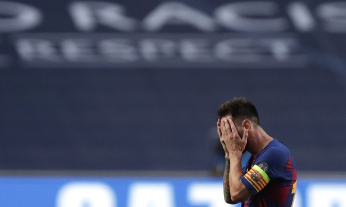Barcelonas Argentinian forward Lionel Messi reacts after Bayern Munichs third goal during the UEFA Champions League quarter-final football match between Barcelona and Bayern Munich at the Luz stadium in Lisbon on August 14, 2020. (Photo by Manu Fernandez / POOL / AFP)