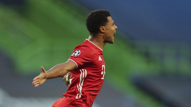 Bayern's Serge Gnabry celebrates after scoring the opening goal of his team during the Champions League semifinal soccer match between Lyon and Bayern Munich at the Jose Alvalade stadium in Lisbon, Portugal, Wednesday, Aug. 19, 2020. (Miguel A. Lopes/Pool via AP)