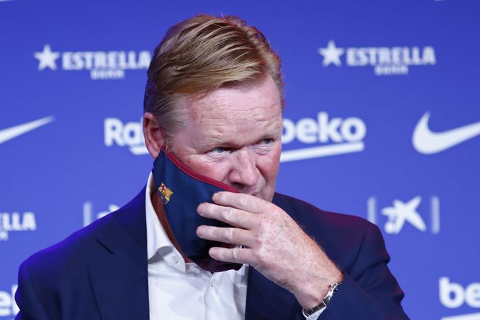 Ronald Koeman Ronald Koeman takes of his protective face mask during his official presentation as coach for FC Barcelona in Barcelona, Spain, Wednesday, Aug. 19, 2020. Barcelona officially announced earlier on Wednesday a deal with Koeman to become their coach five days after the teams humiliating 8-2 loss to Bayern Munich in the Champions League quarterfinals. Barcelona says the former defenders deal runs through June 2022. Koeman replaces the fired Quique Setien. (AP Photo/Joan Monfort)
