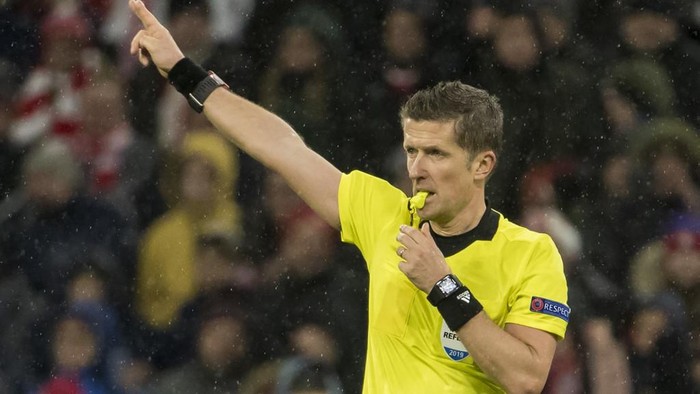 Italian referee Daniele Orsato directs play during the UEFA Champions League, last 16, second leg football match Bayern Munich v Liverpool in Munich, southern Germany, on March 13, 2019. (Photo by Odd ANDERSEN / AFP)