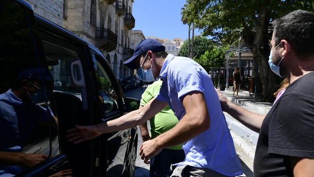England soccer player Harry Maguire leaves a court building on the Aegean island of Syros, Greece, on Saturday, Aug. 22, 2020. The Manchester United captain was arrested during a brawl on the neighbouring holiday island of Mykonos. (AP Photo/Michalis Varaklas)