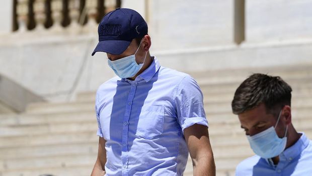 England soccer player Harry Maguire leaves a court building on the Aegean island of Syros, Greece, on Saturday, August 22, 2020. The Manchester United captain was arrested during a brawl on the neighbouring holiday island of Mykonos. (AP Photo/Michalis Varaklas)