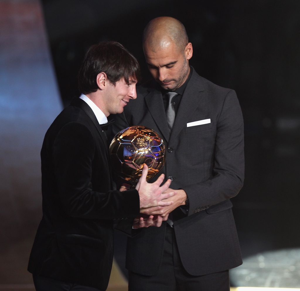ZURICH, SWITZERLAND - JANUARY 10:  Lionel Messi (l) of Argentina and Barcelona FC receives the men's player of the year award from his club coach Pep Guardiola (r) during the FIFA Ballon d'or Gala at the Zurich Kongresshaus on January 10, 2011 in Zurich, Switzerland.  (Photo by Michael Steele/Getty Images)