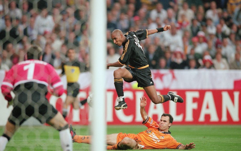 9 May 2000:  Nicolas Anelka of Real Madrid goes past Patrik Angersson of Bayern during the Bayern Munich v Real Madrid Champions League Semi-Final second leg at the Olympic Stadium, Munich, Germany. Mandatory Credit: Ross Kinnaird/ALLSPORT