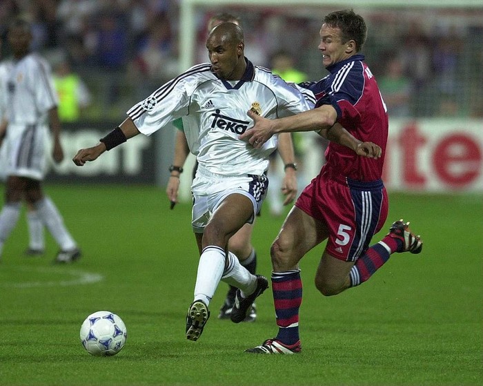 9 May 2000:  Nicolas Anelka of Real Madrid goes past Patrik Angersson of Bayern during the Bayern Munich v Real Madrid Champions League Semi-Final second leg at the Olympic Stadium, Munich, Germany. Mandatory Credit: Ross Kinnaird/ALLSPORT