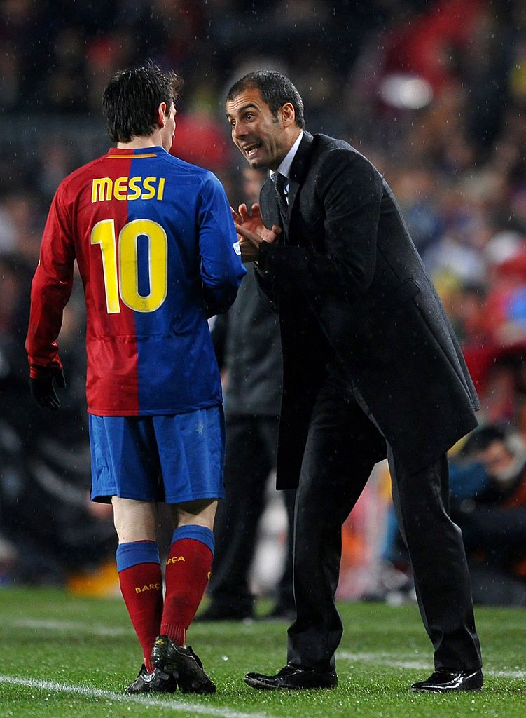 BARCELONA, SPAIN - DECEMBER 13:  Coach Pep Guardiola (R) of Barcelona instructs Lionel Messi during the La Liga match between Barcelona and Real Madrid at the Camp Nou Stadium on December 13, 2008 in Barcelona, Spain. Barcelona won the match 2-0.  (Photo by Jasper Juinen/Getty Images)