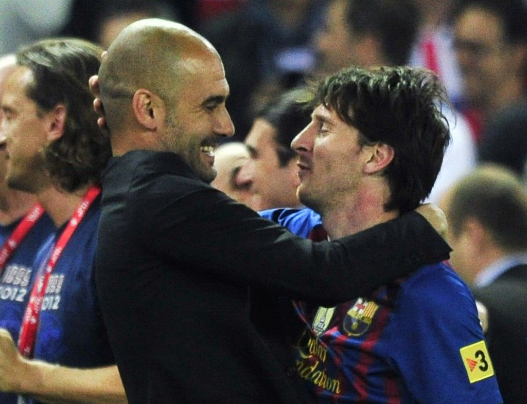 (FILES) In this file photo taken on May 25, 2012 Barcelona's coach Josep Guardiola (L) embraces Barcelona's Argentinian forward Lionel Messi (R) at the end of the Spanish King's Cup final football match between Athletic Bilbao and FC Barcelona at the Vicente Calderon stadium in Madrid. - Six-time Ballon d'Or winner Lionel Messi told Barcelona he wants to leave -- on a free transfer -- in a 