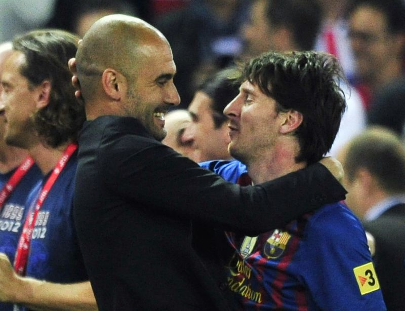 (FILES) In this file photo taken on May 25, 2012 Barcelona's coach Josep Guardiola (L) embraces Barcelona's Argentinian forward Lionel Messi (R) at the end of the Spanish King's Cup final football match between Athletic Bilbao and FC Barcelona at the Vicente Calderon stadium in Madrid. - Six-time Ballon d'Or winner Lionel Messi told Barcelona he wants to leave -- on a free transfer -- in a 