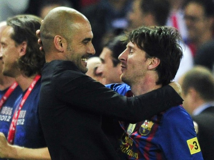 (FILES) In this file photo taken on May 25, 2012 Barcelona's coach Josep Guardiola (L) embraces Barcelona's Argentinian forward Lionel Messi (R) at the end of the Spanish King's Cup final football match between Athletic Bilbao and FC Barcelona at the Vicente Calderon stadium in Madrid. - Six-time Ballon d'Or winner Lionel Messi told Barcelona he wants to leave -- on a free transfer -- in a 