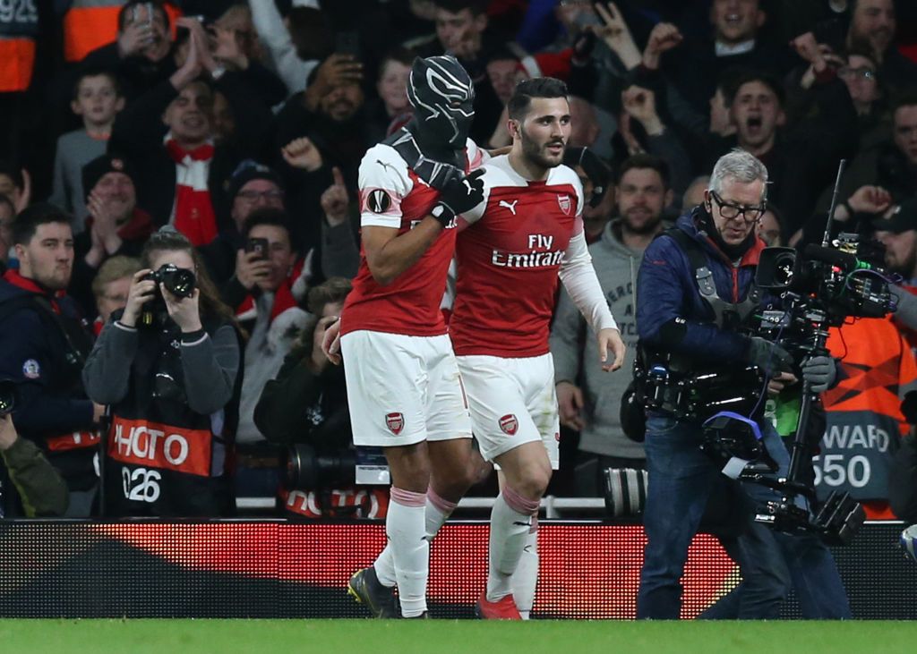 LONDON, ENGLAND - MARCH 14:  Pierre-Emerick Aubameyang of Arsenal dons a Black Panther mask as he celebrates after scoring his team's third goal with Sead Kolasinac of Arsenal during the UEFA Europa League Round of 16 Second Leg match between Arsenal and Stade Rennais at Emirates Stadium on March 14, 2019 in London, England. (Photo by Alex Morton/Getty Images)
