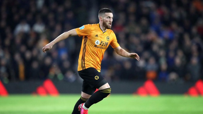 WOLVERHAMPTON, ENGLAND - FEBRUARY 14: Matt Doherty of Wolverhampton Wanderers runs with the ball during the Premier League match between Wolverhampton Wanderers and Leicester City at Molineux on February 14, 2020 in Wolverhampton, United Kingdom. (Photo by Alex Pantling/Getty Images)