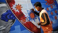 Mural di Bukit Duri Ini Minta Warga Waspada COVID-19