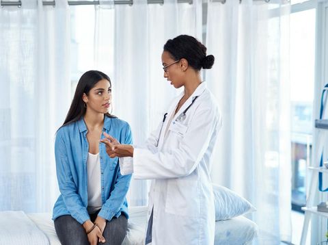 Shot of a young woman having a consultation with her doctor