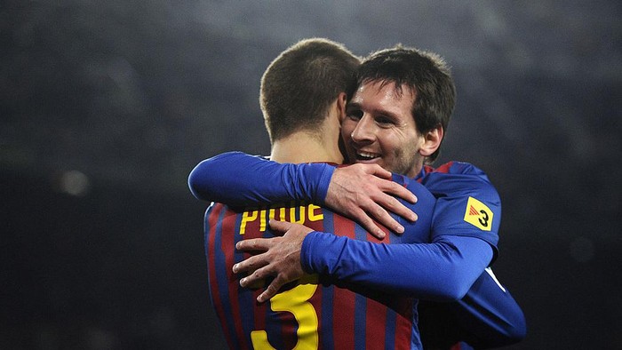 BARCELONA, SPAIN - JANUARY 04:  Lionel Messi of FC Barcelona (R)  celebrates with his teammate Gerard Pique of FC Barcelona after scoring his teams third goal during the round of last 16 Copa del Rey 1st leg match between FC Barcelona and CZ Osasuna at Camp Nou on January 4, 2012 in Barcelona, Spain.  (Photo by David Ramos/Getty Images)
