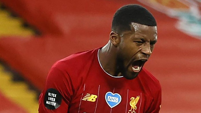 LIVERPOOL, ENGLAND - JULY 22: Georginio Wijnaldum of Liverpool celebrates after scoring his teams third goal during the Premier League match between Liverpool FC and Chelsea FC at Anfield on July 22, 2020 in Liverpool, England. Football Stadiums around Europe remain empty due to the Coronavirus Pandemic as Government social distancing laws prohibit fans inside venues resulting in all fixtures being played behind closed doors. (Photo by Phil Noble/Pool via Getty Images)