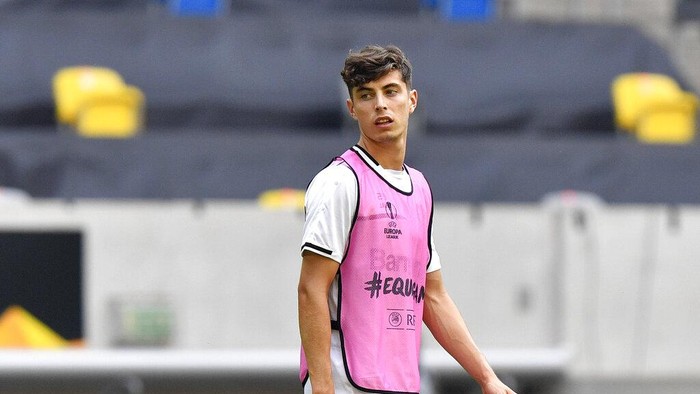 FILE - In this Sunday Aug. 9, 2020 file photo, Leverkusens Kai Havertz looks around during a training session in Duesseldorf, Germany. Bayer Leverkusen forward Kai Havertz left the Germany national team training camp on Friday, Sept. 4 to try to complete his transfer to Chelsea. Leverkusen sports director Rudi Voeller said Havertz is traveling to London “so that Kai can now sort things out on the ground in London with our support.” (AP Photo/Martin Meissner, file)
