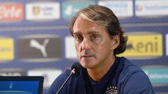 Italy soccer team coach Roberto Mancini speaks to the media at the Coverciano training grounds, in Florence, Italy, Sunday, Aug. 30, 2020. Italy hosts Bosnia-Herzegovina inside an empty stadium on Friday, Sept. 4, 2020, in the Nations League. “I’ll definitely feel a bit sad,” Mancini said about the prospect of playing in an empty stadium, due to the coronavirus pandemic. (Jennifer Lorenzini/LaPresse via AP)