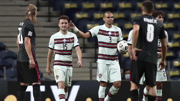 Portugals Diogo Jota, 2nd left, celebrates after scoring his sides second goal during the UEFA Nations League soccer match between Portugal and Croatia at the Dragao stadium in Porto, Portugal, Saturday, Sept. 5, 2020. (AP Photo/Miguel Angelo Pereira)