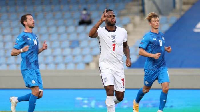 REYKJAVIK, ICELAND - SEPTEMBER 05: Raheem Sterling of England celebrates scoring his sides first goal from the penalty spot during the UEFA Nations League group stage match between Iceland and England at Laugardalsvollur National Stadium on September 05, 2020 in Reykjavik, Iceland. (Photo by Haflidi Breidfjord/Getty Images)