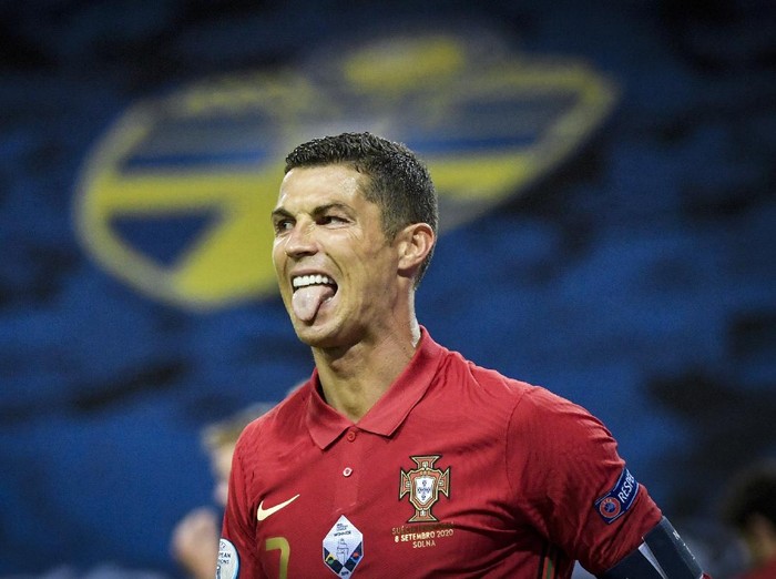 Portugal's Cristiano Ronaldo sticks out his tongue during the Portugal against Sweden UEFA Nations League Group stage soccer match at Friends Arena in Stockholm, Sweden, Tuesday Sept. 8, 2020. (Janerik Henriksson/TT via AP)
