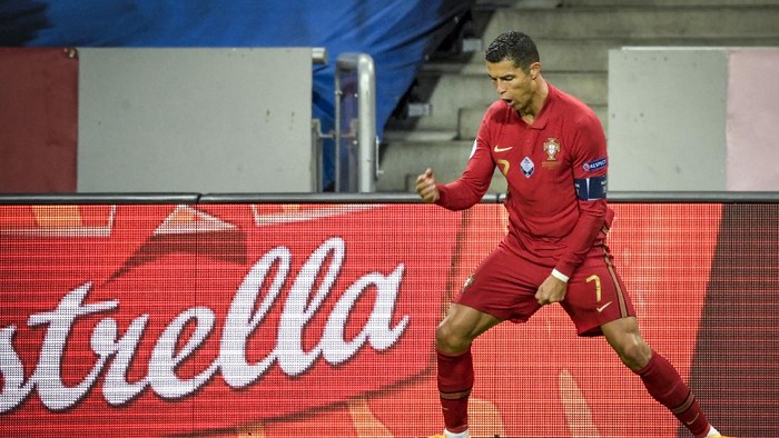 Portugals Cristiano Ronaldo celebrates scoring his second goal against Sweden during their UEFA Nations League Group stage soccer match at Friends Arena in Stockholm, Sweden, Tuesday Sept. 8, 2020. (Janerik Henriksson/TT via AP)
