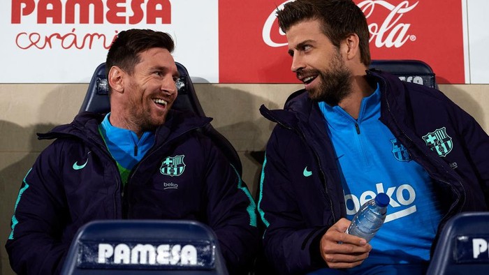 BARCELONA, SPAIN - SEPTEMBER 18:  Lionel Messi of FC Barcelona celebrates with his team-mate Gerard Pique after scoring his teams fourth goal during the UEFA Champions League Group H match between FC Barcelona and Ajax Amsterdam ag the Camp Nou stadium on September 18, 2013 in Barcelona, Spain.  (Photo by David Ramos/Getty Images)