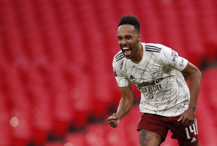 Arsenal's Pierre-Emerick Aubameyang celebrates after scores the winning penalty in a penalty shootout at the end of the English FA Community Shield soccer match between Arsenal and Liverpool at Wembley stadium in London, Saturday, Aug. 29, 2020. (Andrew Couldridge/Pool via AP)