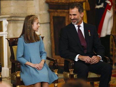 Spain's King Felipe sits next to his daughter Princess Leonor during a ceremony in which Princess Leonor was presented with the insignia of the 