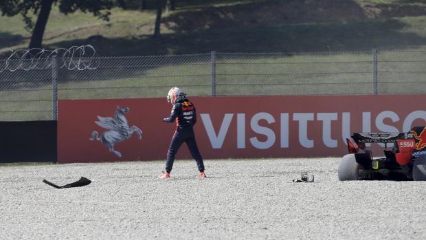 Red Bull driver Max Verstappen of the Netherlands stands next to his car following a crash during the Formula One Grand Prix of Tuscany, at the Mugello circuit in Scarperia, Italy, Sunday, Sept. 13, 2020. (AP Photo/Luca Bruno, Pool)