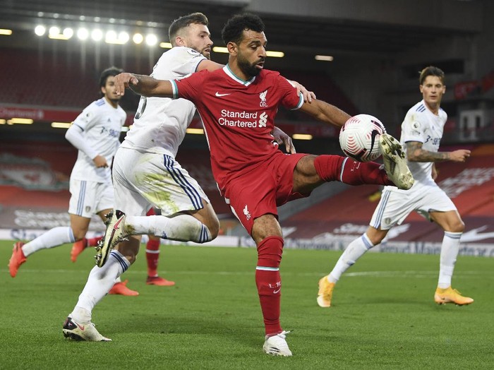 Liverpools Mohamed Salah, right, and Leeds Uniteds Stuart Dallas fight for the ball during the English Premier League soccer match between Liverpool and Leeds United, at the Anfield stadium, in Liverpool, Saturday, Sept. 12, 2020. (Shaun Botterill, Pool via AP)