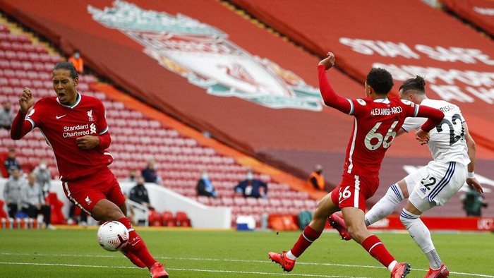 Leeds Uniteds Jack Harrison scores his sides first goal during the English Premier League soccer match between Liverpool and Leeds United, at the Anfield stadium, in Liverpool, Saturday, Sept. 12, 2020. (Phil Noble, Pool via AP)