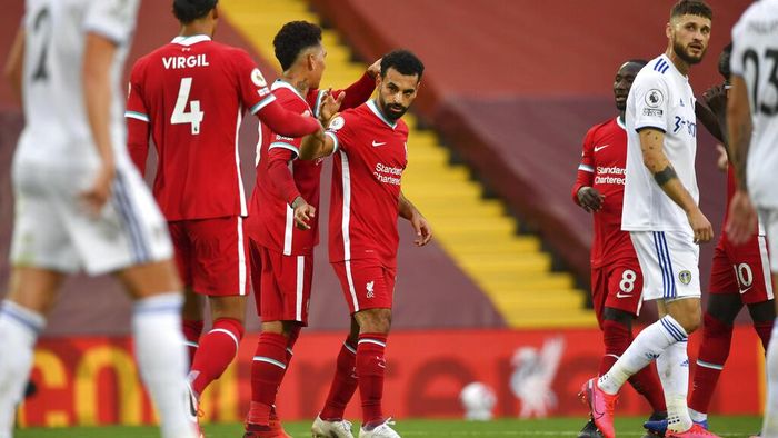 Liverpool vs Leeds United Liverpools Mohamed Salah, center, celebrates with his teammates after he scored his sides third goal during the English Premier League soccer match between Liverpool and Leeds United, at the Anfield stadium, in Liverpool, Saturday, Sept. 12, 2020. (Paul Ellis, Pool via AP)