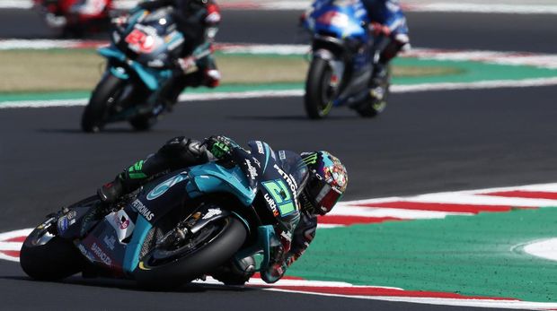 MotoGP rider Franco Morbidelli of Italy takes a curve at the start of the San Marino Motorcycle Grand Prix at the Misano circuit in Misano Adriatico, Italy, Sunday, Sept. 13, 2020. (AP Photo/Antonio Calanni)