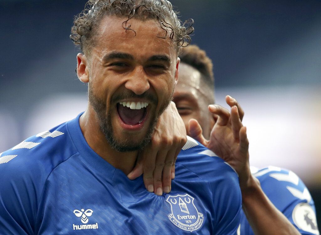 Everton's Dominic Calvert-Lewin, front, celebrates with teammates after scoring his side's opening goal during the English Premier League soccer match between Tottenham Hotspur and Everton at the Tottenham Hotspur Stadium in London, Sunday, Sept. 13, 2020. (Alex Pantling/Pool via AP)