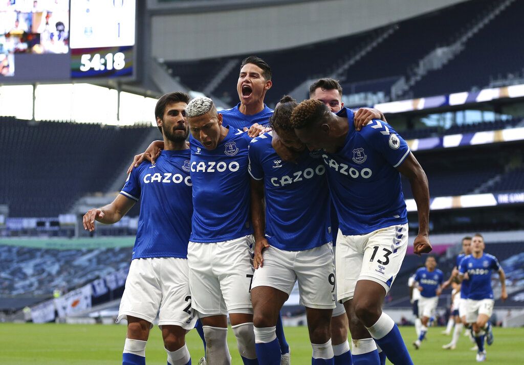 Everton's Dominic Calvert-Lewin, centre, celebrates with teammates after scoring his side's opening goal during the English Premier League soccer match between Tottenham Hotspur and Everton at the Tottenham Hotspur Stadium in London, Sunday, Sept. 13, 2020. (Alex Pantling/Pool via AP)