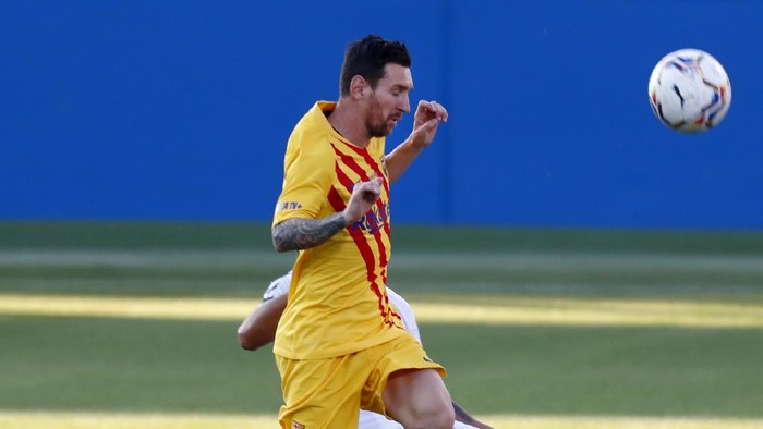 Barcelonas Lionel Messi in action during the pre-season friendly soccer match between Barcelona and Gimnastic at the Johan Cruyff Stadium in Barcelona, Spain, Saturday, Sept.12, 2020. (AP Photo/Joan Monfort)