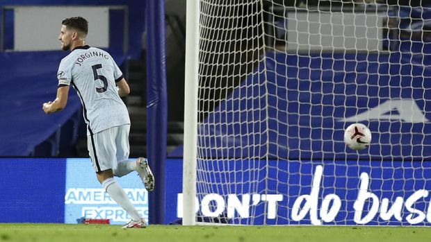 Chelsea's Jorginho celebrates after scoring his team's first goal from the penalty spot during the English Premier League soccer match between Brighton and Chelsea at Falmer Stadium in Brighton, England, Monday, Sept. 14, 2020. (Peter Cziborra/Pool via AP)