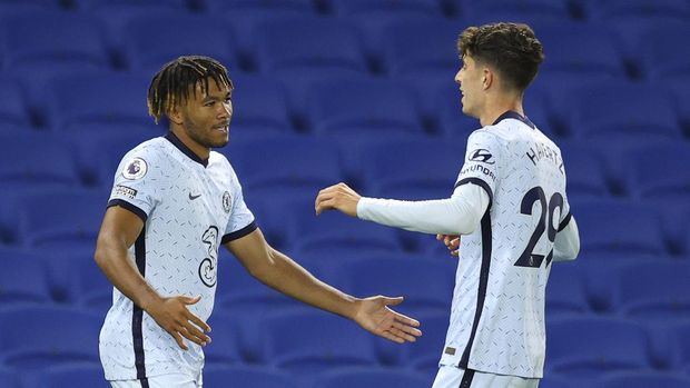 Chelsea's Reece James, left, is congratulated by teammate Kai Havertz after scoring his team's second goal during the English Premier League soccer match between Brighton and Chelsea at Falmer Stadium in Brighton, England, Monday, Sept. 14, 2020. (Richard Heathcote/Pool via AP)