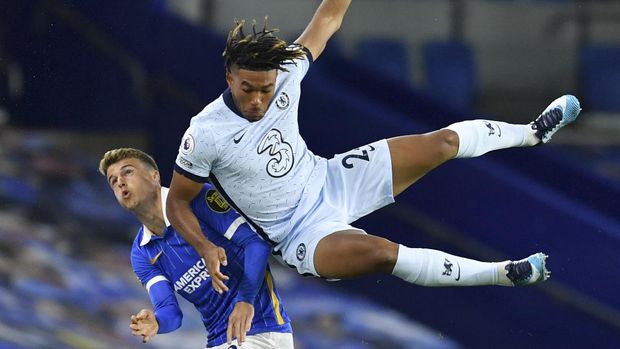 Chelsea's Reece James, right, and Brighton's Solly March contest for the ball during the English Premier League soccer match between Brighton and Chelsea at Falmer Stadium in Brighton, England, Monday, Sept. 14, 2020. (Glynn Kirk/Pool via AP)
