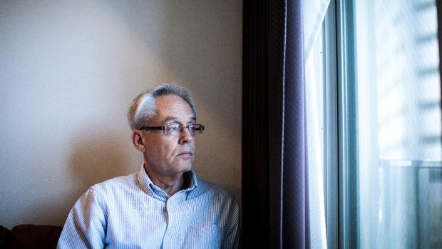 In this picture taken on February 6, 2020 former Nissan executive Greg Kelly, who is charged with financial misconduct, poses at his apartment in Tokyo. - Kelly, a former associate of Carlos Ghosn, has told AFP he was 