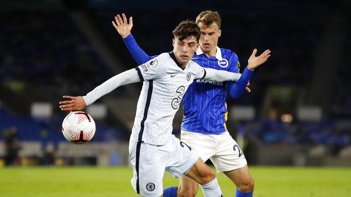 Chelseas Kai Havertz, left, and Brightons Solly March battle for the ball during the English Premier League soccer match between Brighton and Chelsea at Falmer Stadium in Brighton, England, Monday, Sept. 14, 2020. (Peter Cziborra/Pool via AP)