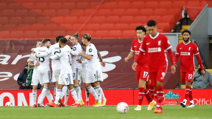 LIVERPOOL, ENGLAND - SEPTEMBER 12: Liverpool  players look dejected as Mateusz Klich of Leeds United celebrates with teammates after scoring his teams third goal during the Premier League match between Liverpool and Leeds United at Anfield on September 12, 2020 in Liverpool, England. (Photo by Phil Noble - Pool/Getty Images)