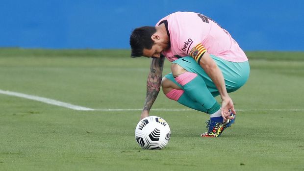 Barcelona's Lionel Messi reacts during the pre-season friendly soccer match between Barcelona and Girona at the Johan Cruyff Stadium in Barcelona, Spain, Wednesday, Sept. 16, 2020. (AP Photo/Joan Monfort)