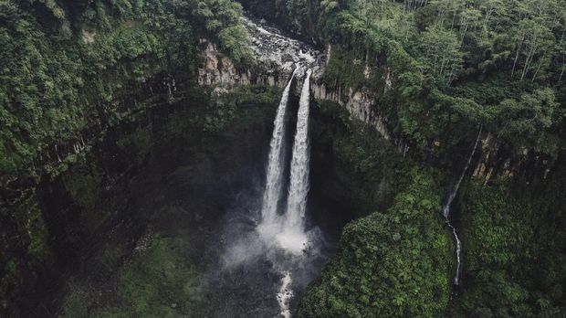 Scenic aerial view of Madakaripura  waterfall in the jungles on Java, Indonesia